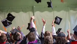 Students throwing hats